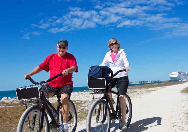 retire-baby-boomer-leisure-exercise-sun-bike-beach-elderly-old-couple