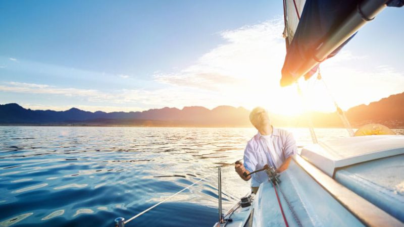 retire-baby-boomer-old-grandparents-sail-boat-leisure-fun-happy-summer