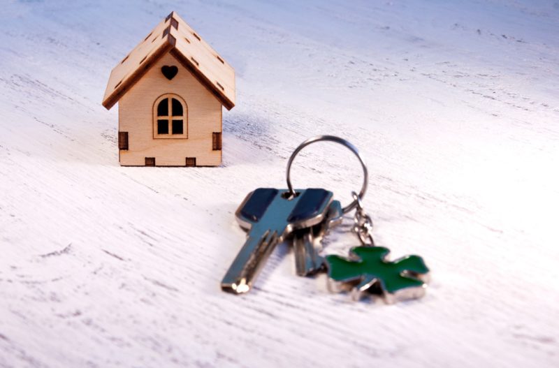 The Little House Next To It Is The Keys. Symbol Of Hiring A House For Rent, Selling A Home, Buying A Home, A Mortgage